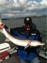 Andy Carson with a sturgeon