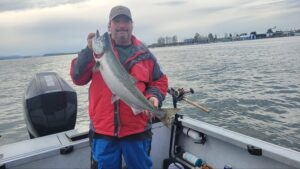 A client holding a salmon caught on the Columbia River.