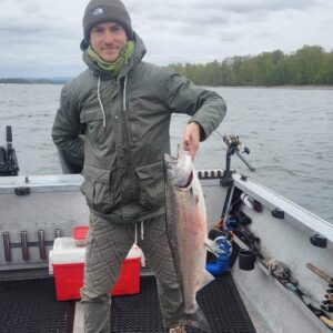 Happy angler holds up a spring chinook salmon he caught on the Columbia River near Portland on April 4.